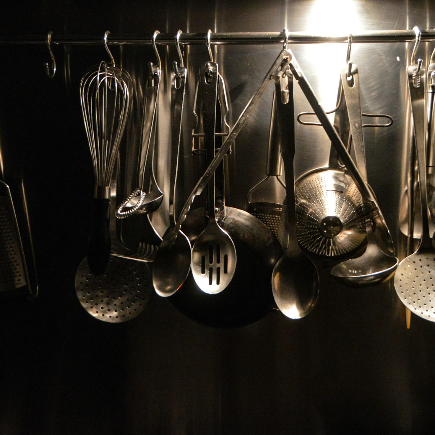Community members collaborating in a modern kitchen space, sharing recipes and cooking techniques